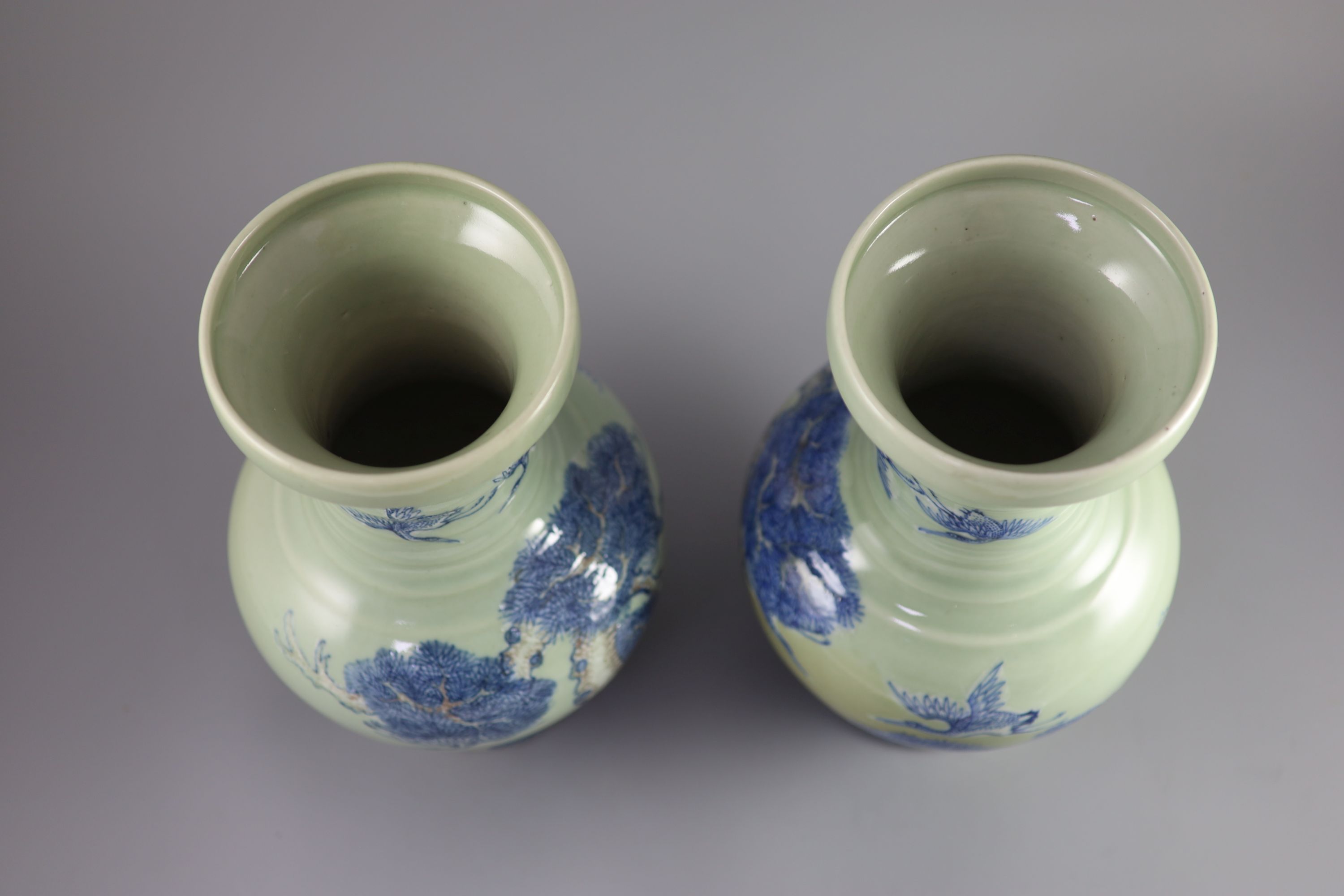 A pair of Chinese underglaze blue and copper red celadon ground vases, probably Republic period 31.5 and 32 cm high